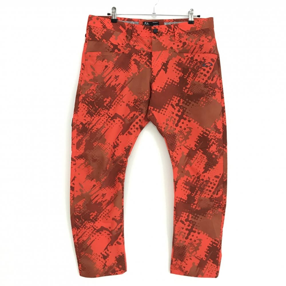 【超美品】オークリー パンツ オレンジ×ブラウン 総柄 ロゴ刺しゅう ストレッチ  メンズ 38 ゴルフウェア Oakley