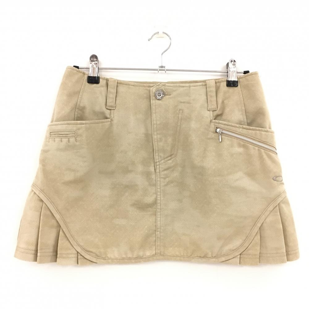 【美品】オークリー スカート ベージュ 地模様 サイドプリーツ ティー装着可 レディース M ゴルフウェア Oakley
