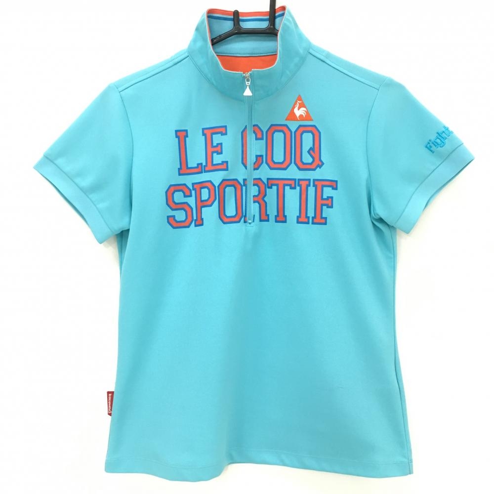 ルコックゴルフ 半袖ハイネックシャツ ライトブルー×オレンジ フロントロゴ ハーフジップ レディース L ゴルフウェア le coq sportif