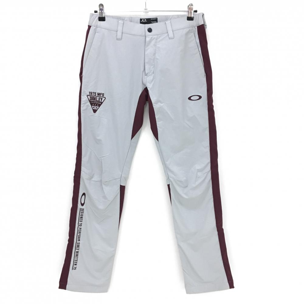 【美品】オークリー パンツ ライトグレー×ボルドー バイカラー ロゴ刺しゅう メンズ M ゴルフウェア Oakley